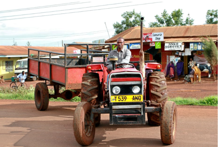 A Tanzanian farmer tractor driver in Makuyuni, Arusha, Tanzania. Shutterstock