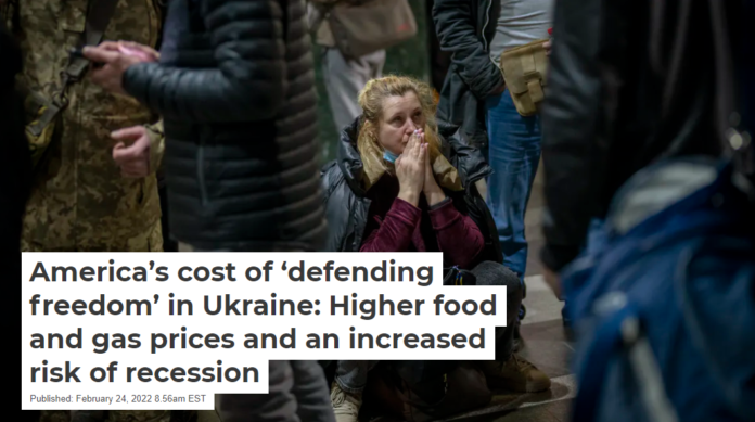 A woman in Ukraine appears to pray as she waits for a train out of Kyiv. AP Photo/Emilio Morenatti