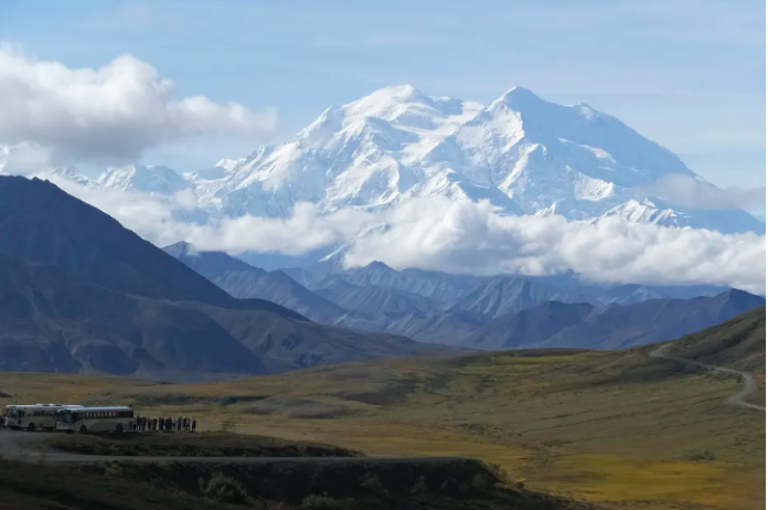 Sightseeing buses at a pullout popular for taking in views of North America’s tallest peak, Denali, in Denali National Park and Preserve, Alaska, in 2016. AP Photo/Becky Bohrer