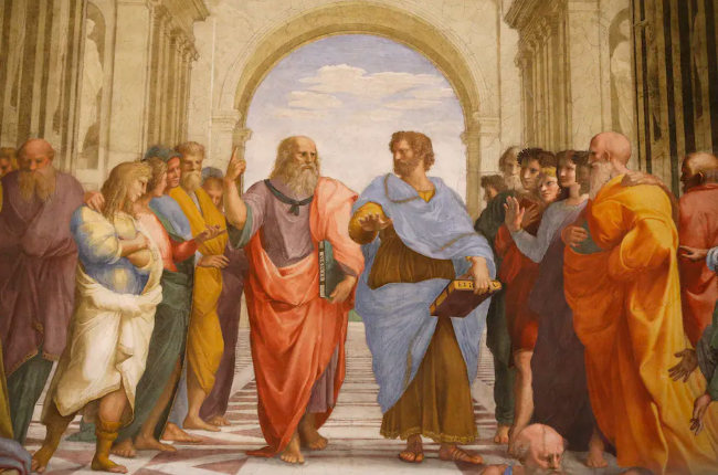 Aristotle (center), wearing a blue robe, seen in a discourse with Plato in a 16th century fresco, ‘The School of Athens’ by Raphael. Pascal Deloche/Stone via Getty Images
