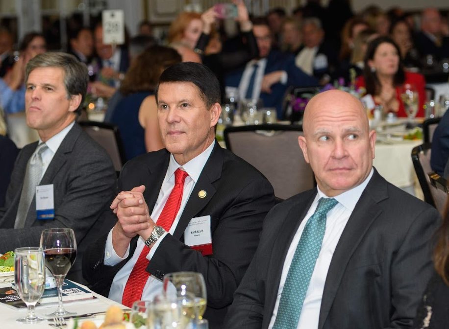 Keith Krach (center), seated with Timothy Schriver, Chairman Special Olympics (left), and H.R. McMaster, former White House National Security Advisor