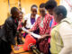 The Silver Lining For A Small Non-Profit – How shifts during the Covid-19 pandemic led to long term changes A group of young women in the Neema Project work together building various skillsets