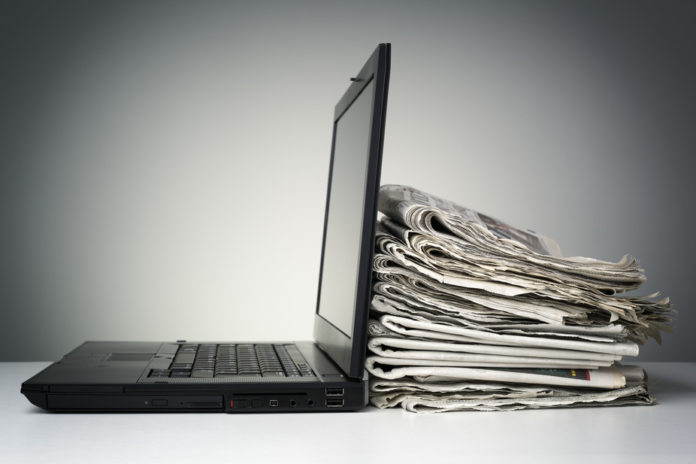 Over 500 daily newspapers now use paywalls. Are they working? 'laptop' via www.shutterstock.com
