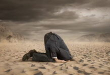 Many Americans are choosing not to engage with politics, instead sticking their heads in the sand to protect their mental health. iStock/Getty Images Plus