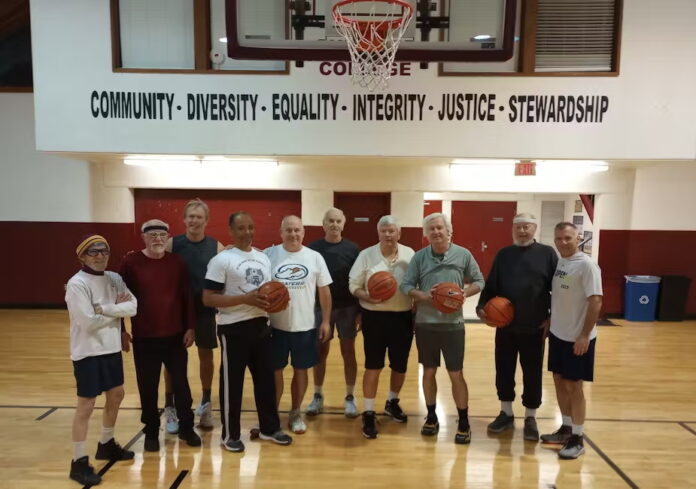 Several geezers appear on the court before a 5-on-5 pickup game. Andy Casper, CC BY-SA