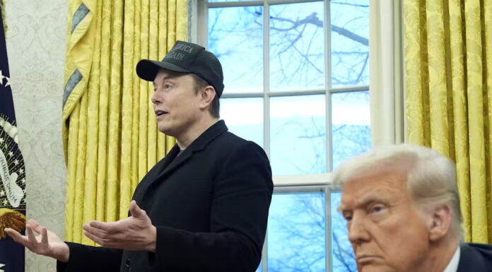 President Donald Trump listens as Elon Musk speaks in the Oval Office on Feb. 11, 2025. Alex Brandon/Associated Press