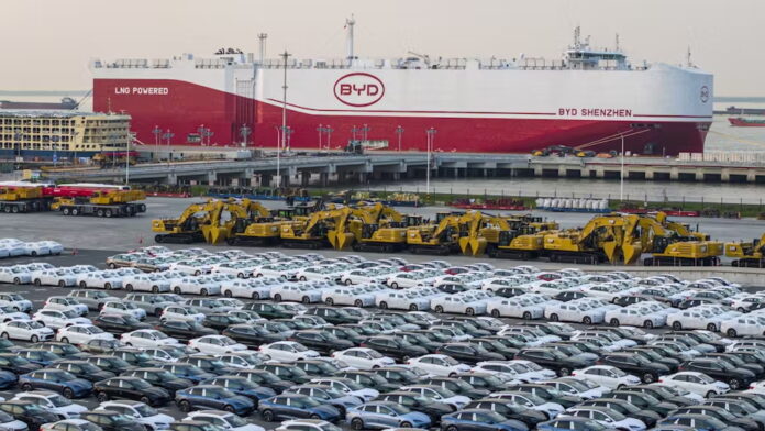 BYD electric cars wait at a Chinese port to be loaded onto the automobile carrier BYD Shenzhen, which was slated to sail to Brazil. STR/AFP via Getty Images
