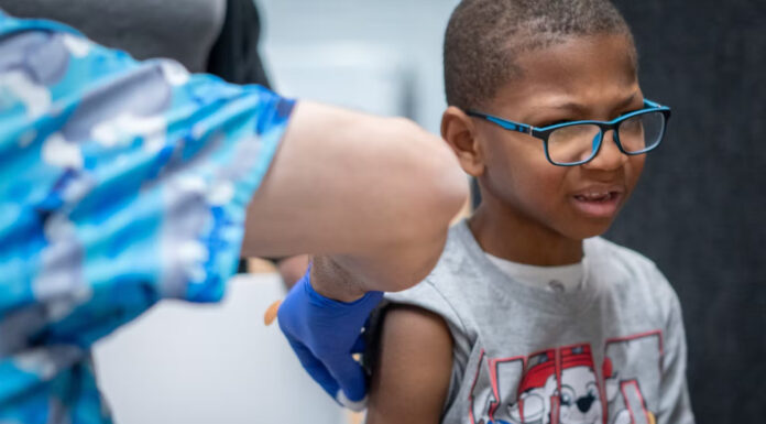 Xerius Jackson, age 7, gets an MMR vaccine during the Texas measles outbreak in March 2025. Jan Sonnenmair via Getty Images