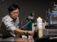 Prof. Jie Huang stands with the MOF-based breathalyzer his lab developed with support from the NIH. Michael Pierce/Missouri S&T