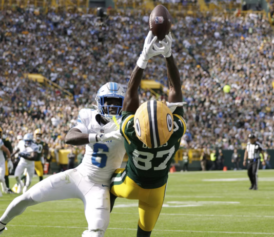 Green Bay Packers wide receiver Romeo Doubs (87) and Detroit Lions cornerback Terrion Arnold (6) show off their athleticism on Sept. 7, 2025. AP Photo/Matt Ludtke