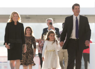 Left to right: Metta Krach, Jacqueline and Marc Carlson (background), Emma and Keith Krach
