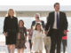Left to right: Metta Krach, Jacqueline and Marc Carlson (background), Emma and Keith Krach