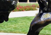 SEEGRAIN in the outstretched hand of Rodin's hero citizen of Calais is a monumental symbol of the mission to establish trust, good faith, and collaboration among all